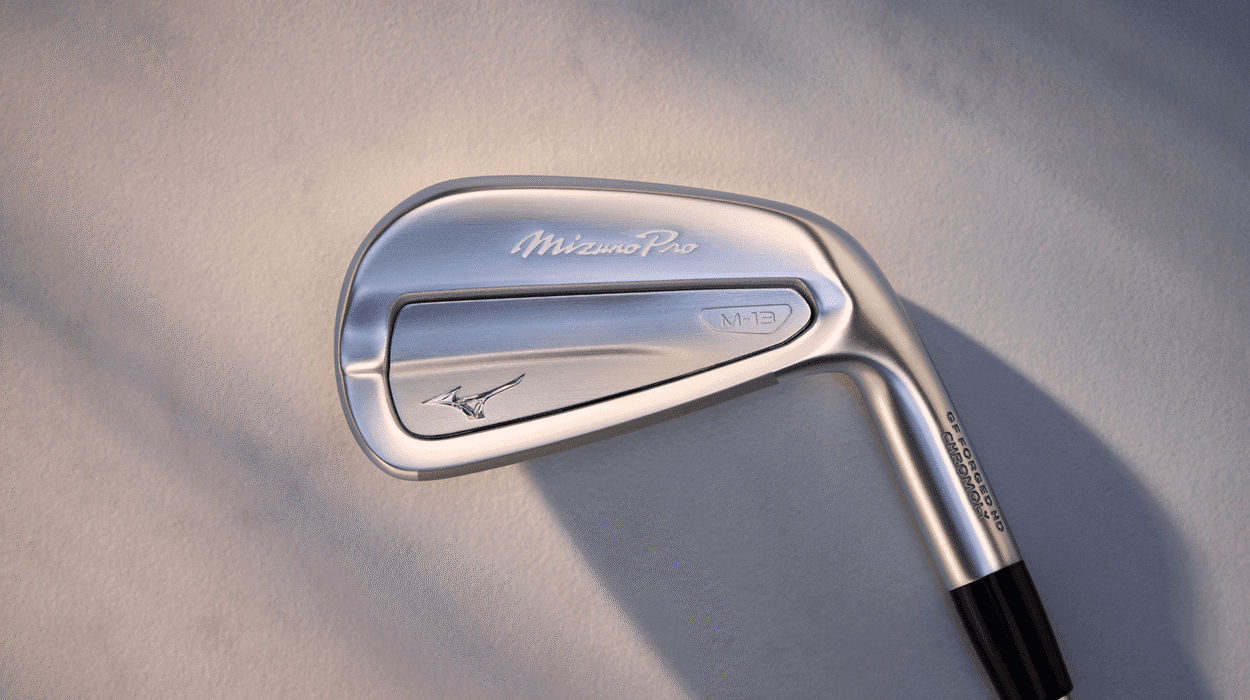 Close-up of a Mizuno golf iron club showing its polished finish and ergonomic design